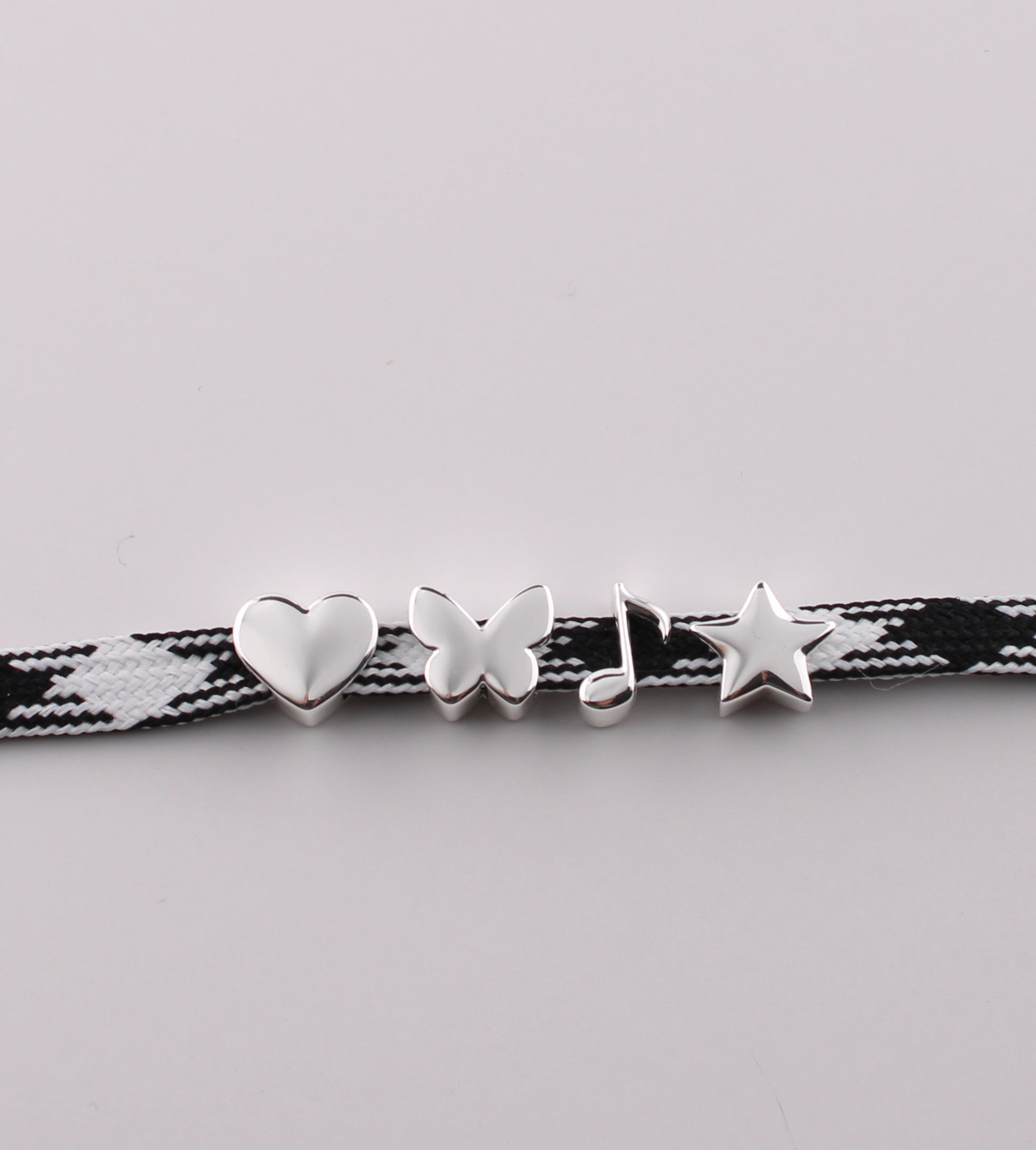 Silver emoji sneaker charms heart butterfly music note and star on black checkered shoelace - silver emoji charms